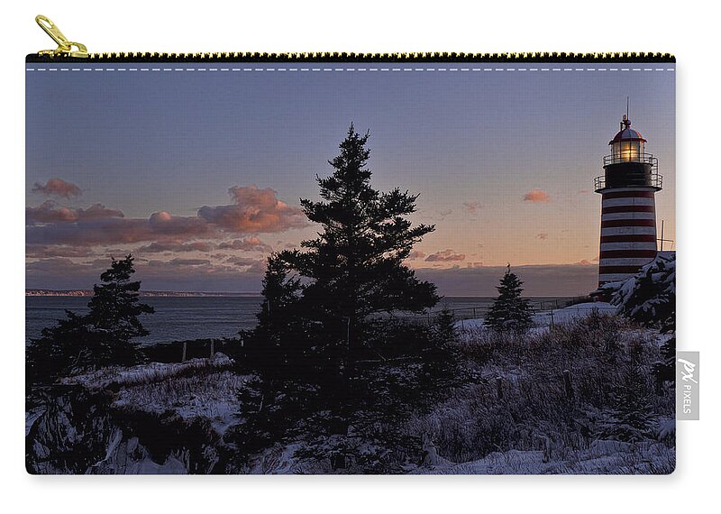West Quoddy Head Lighthouse Zip Pouch featuring the photograph Winter Sentinel Lighthouse by Marty Saccone