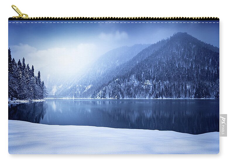Water's Edge Zip Pouch featuring the photograph Winter Shot Of Lake In Mountains by Sankai