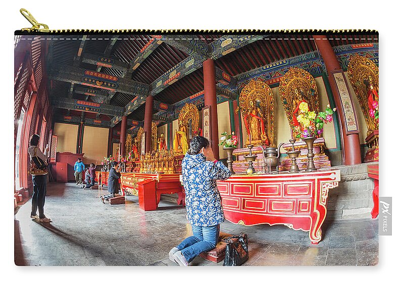 Chinese Culture Zip Pouch featuring the photograph Woman In Front Of Altar, Lama Temple by Peter Adams