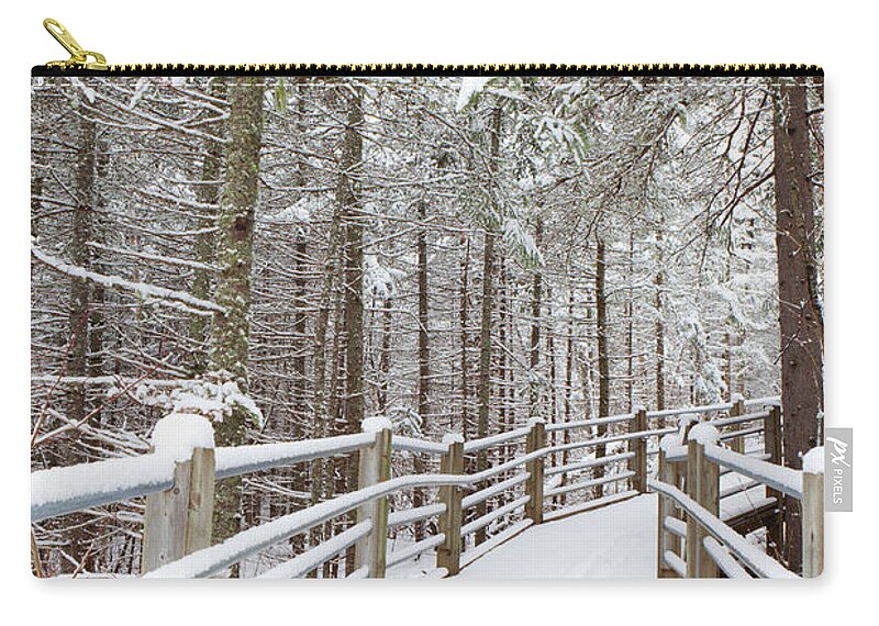 Snow Zip Pouch featuring the photograph Wooden Walkway And Railings Covered by Susan Dykstra / Design Pics