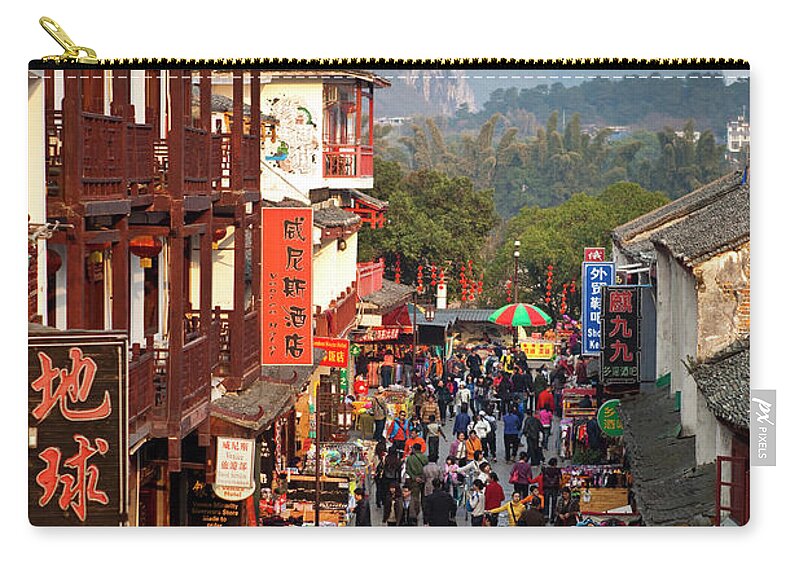 Yangshuo Zip Pouch featuring the photograph Xi Jie Pedestrian Mall by Richard I'anson