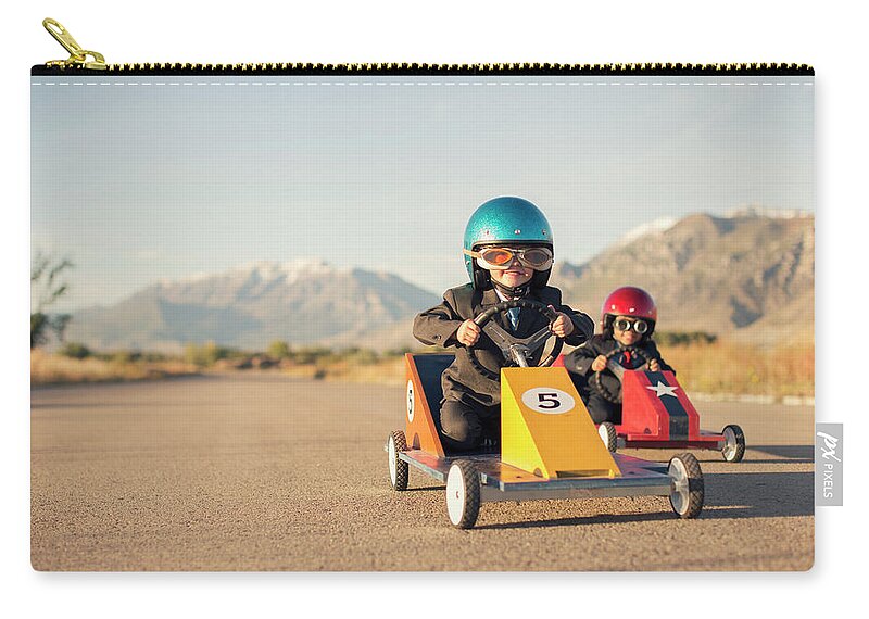 Cool Attitude Zip Pouch featuring the photograph Young Boy Races Toy Car Wearing by Richvintage