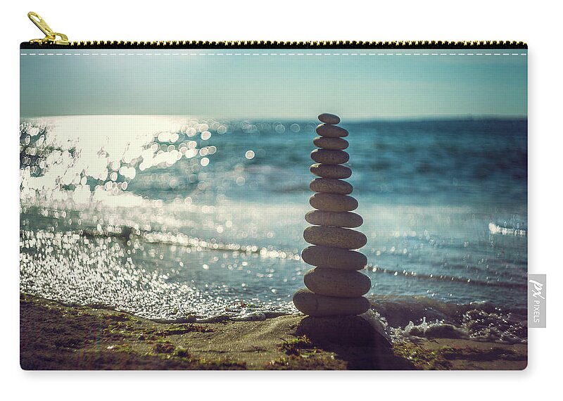 Tranquility Zip Pouch featuring the photograph Zen Stones Beach Sunset by Chris Dève