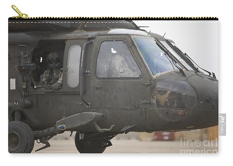 Aviation Zip Pouch featuring the photograph A Uh-60 Black Hawk Taxis #1 by Terry Moore