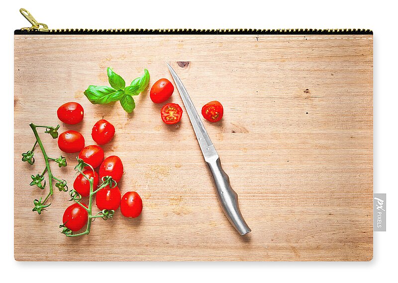 Aromatic Zip Pouch featuring the photograph Cherry tomatoes #1 by Tom Gowanlock