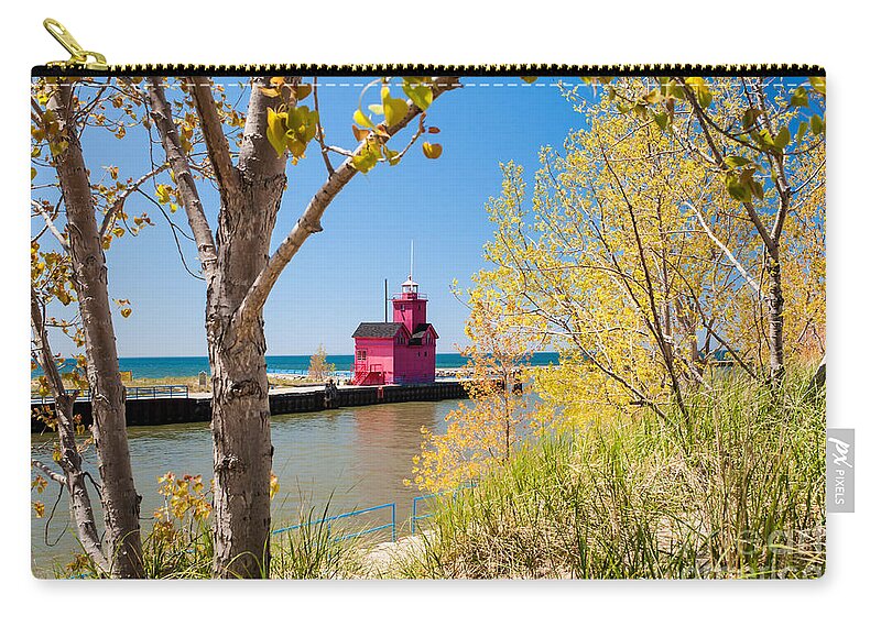 Holland Zip Pouch featuring the photograph Holland MI Lighthouse #1 by Larry Carr