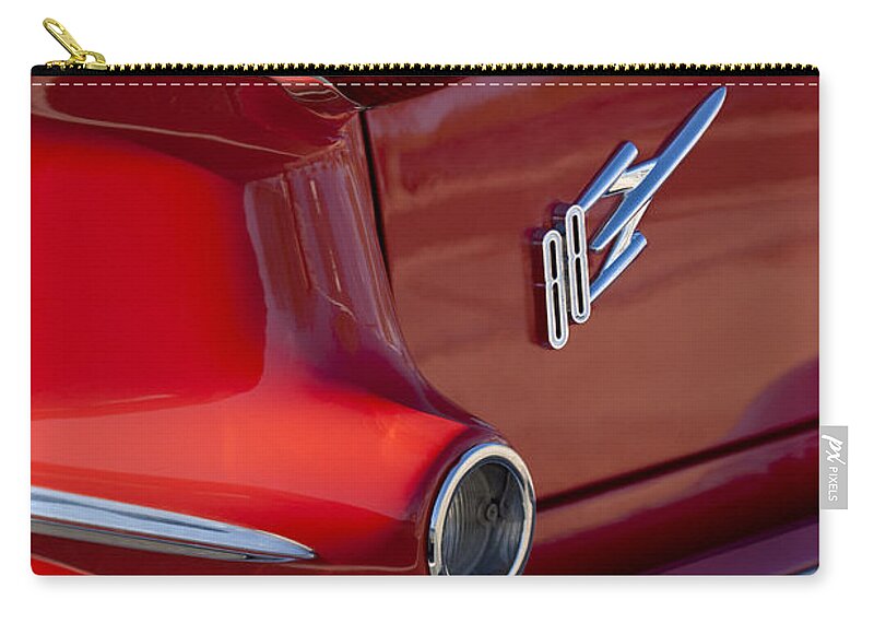 1956 Oldsmobile 88 Carry-all Pouch featuring the photograph 1956 Oldsmobile 88 Taillight Emblem by Jill Reger