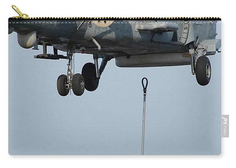 Vertical Zip Pouch featuring the photograph Airmen Assist Each Other As They Hook by Stocktrek Images