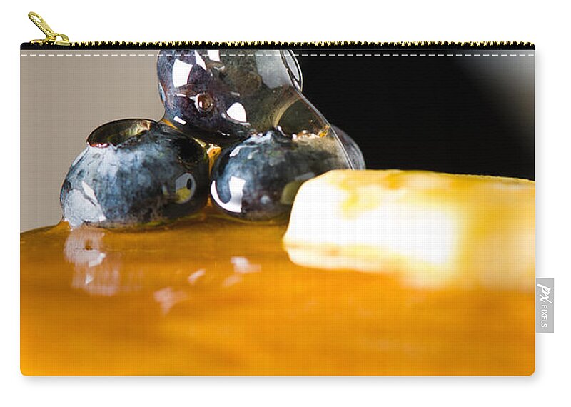 Berries Zip Pouch featuring the photograph Blueberry butter pancake with honey maple sirup flowing down by U Schade