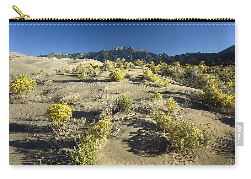 00174902 Zip Pouch featuring the photograph Flowering Shrubs On The Dune Fields by Tim Fitzharris