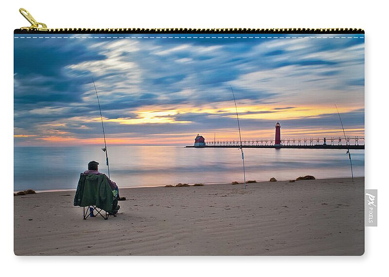Grand Haven Zip Pouch featuring the photograph Lake Michigan Fishing by Larry Carr