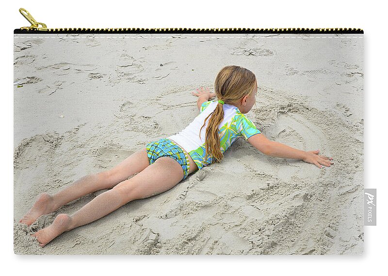 Sand Zip Pouch featuring the photograph Making a Sand Angel by Maureen E Ritter
