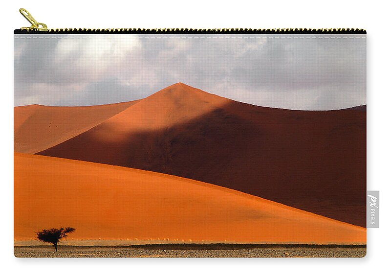 Africa Zip Pouch featuring the photograph Moody tree by Alistair Lyne