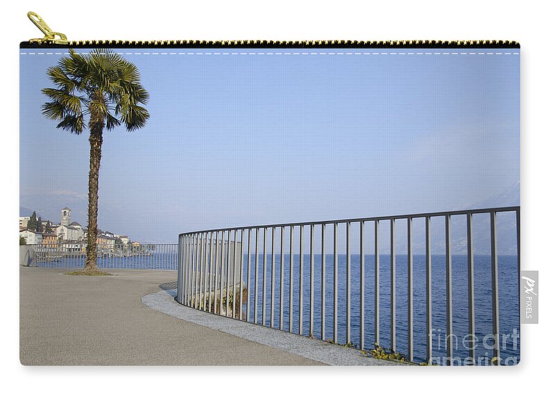 Palm Zip Pouch featuring the photograph Palm tree on the lakefront by Mats Silvan