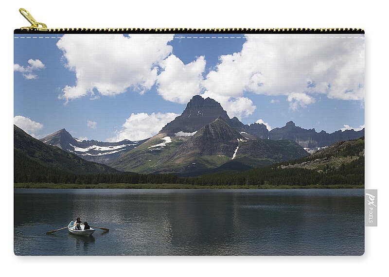 Rowboat Zip Pouch featuring the photograph Rowboat at Many Glacier by Lorraine Devon Wilke