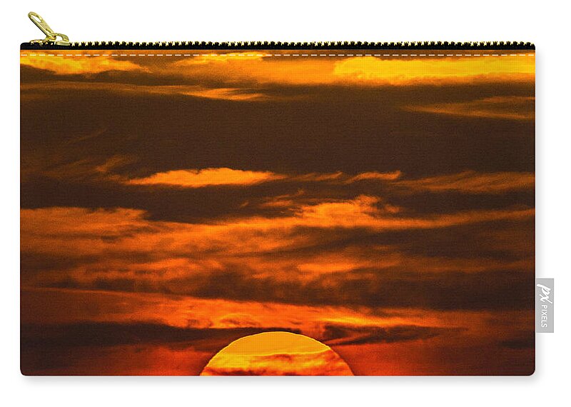 Sun Zip Pouch featuring the photograph Setting Sun Flyby by Shannon Harrington