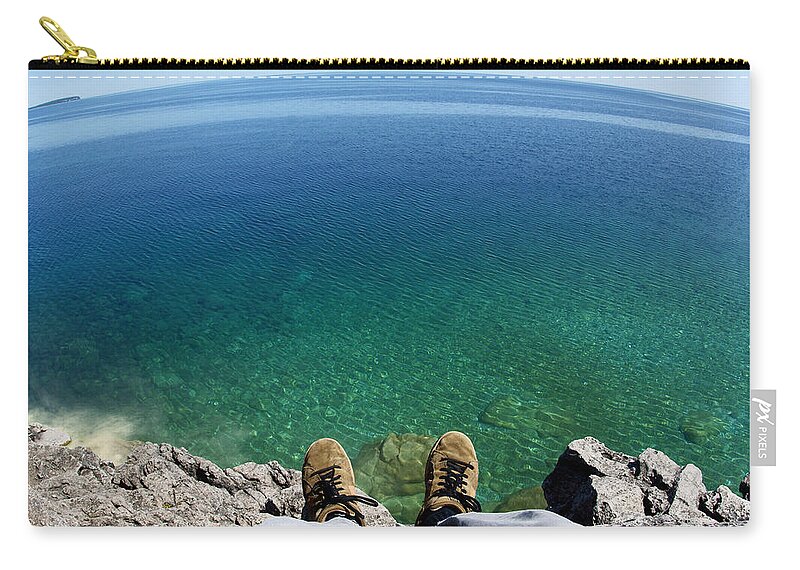 Cliff Zip Pouch featuring the photograph Sitting on a Cliff by Cale Best