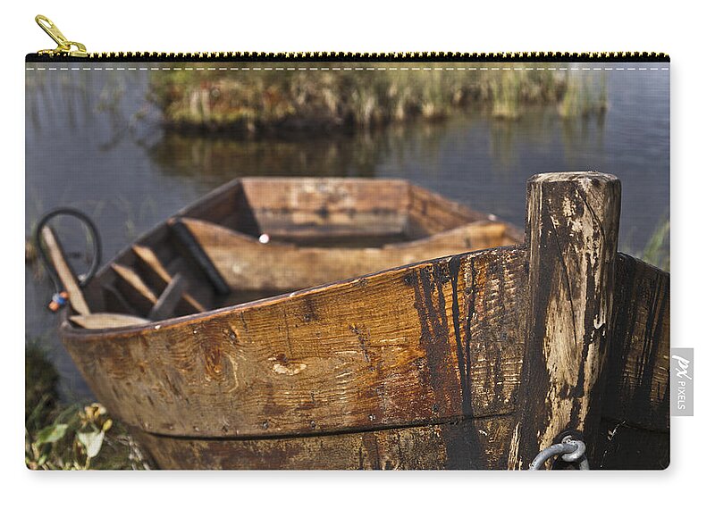 Row Boat Zip Pouch featuring the photograph Skiff in swedish swamp by Heiko Koehrer-Wagner