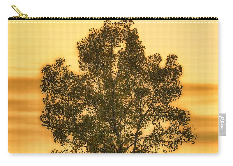 Klondike Park Zip Pouch featuring the photograph Soaking Up A Sunset Glow by Bill and Linda Tiepelman