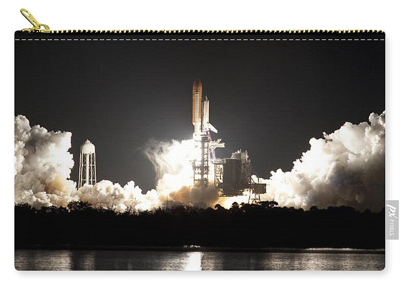 Nasa Zip Pouch featuring the photograph Space Shuttle Discovery Lifts Off by NASA/Ben Cooper
