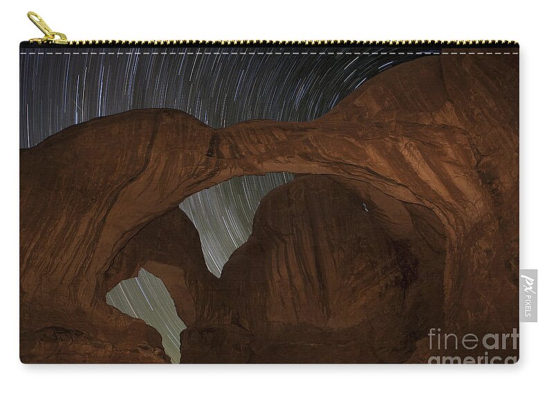 Astrological Photography Zip Pouch featuring the photograph Star trails at Double Arch by Keith Kapple