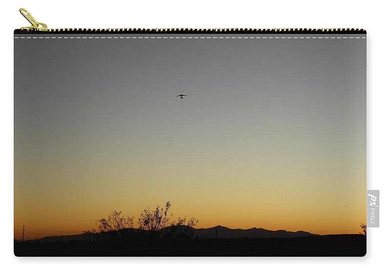 Sunset Zip Pouch featuring the photograph Sunset flight by Kim Galluzzo