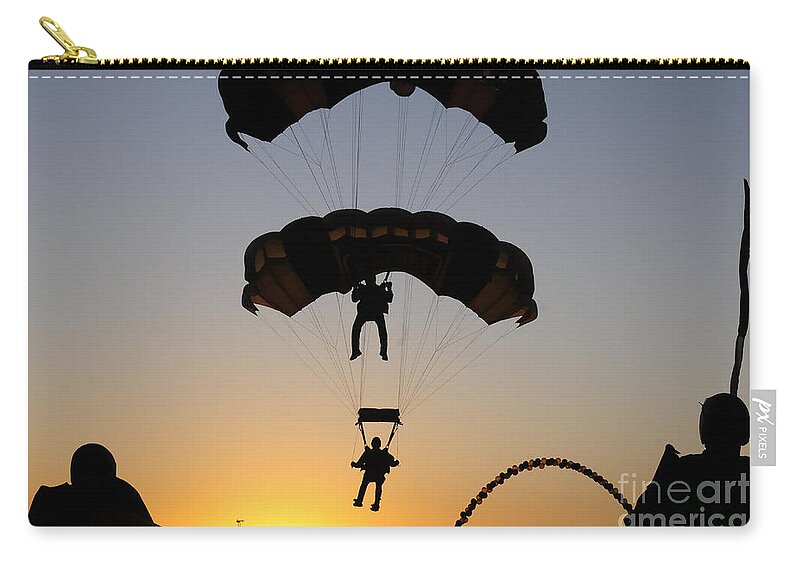 U.s. Army Golden Knights Zip Pouch featuring the photograph The U.s. Army Golden Knights Perform An by Stocktrek Images