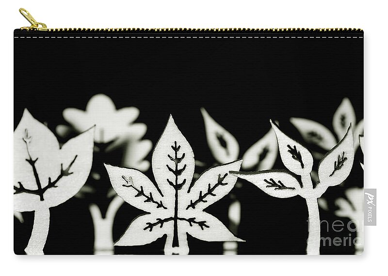 Leaf Zip Pouch featuring the photograph Wooden leaf shapes in black and white by Simon Bratt