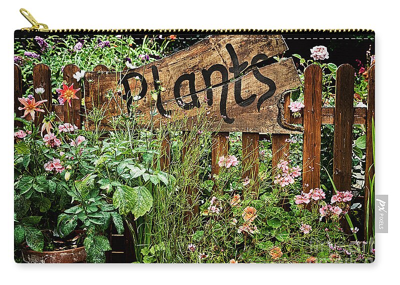 Plants Carry-all Pouch featuring the photograph Wooden plant sign in flowers by Simon Bratt