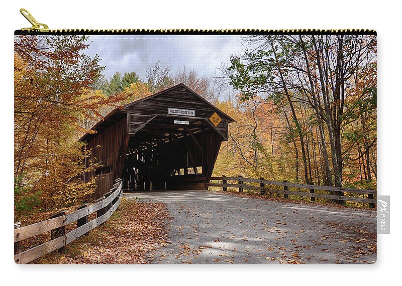 #jefffolger Zip Pouch featuring the photograph Fall colors over the Durgin Covered Bridge #1 by Jeff Folger
