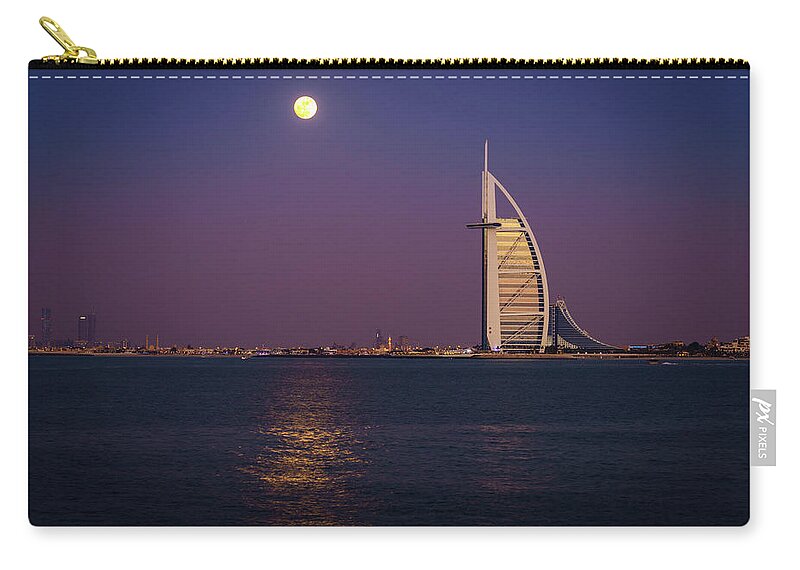 Burj Al Arab Zip Pouch featuring the photograph Moonrise over Burj Al Arab #1 by Alexey Stiop