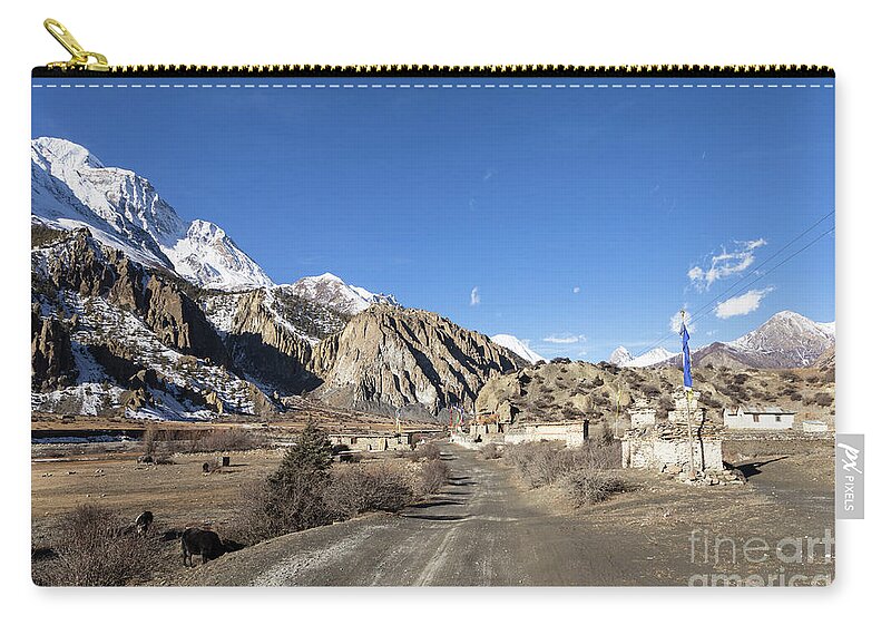 Ancient Zip Pouch featuring the photograph On the Annapurna circuit trekking near Manang in Nepal #1 by Didier Marti