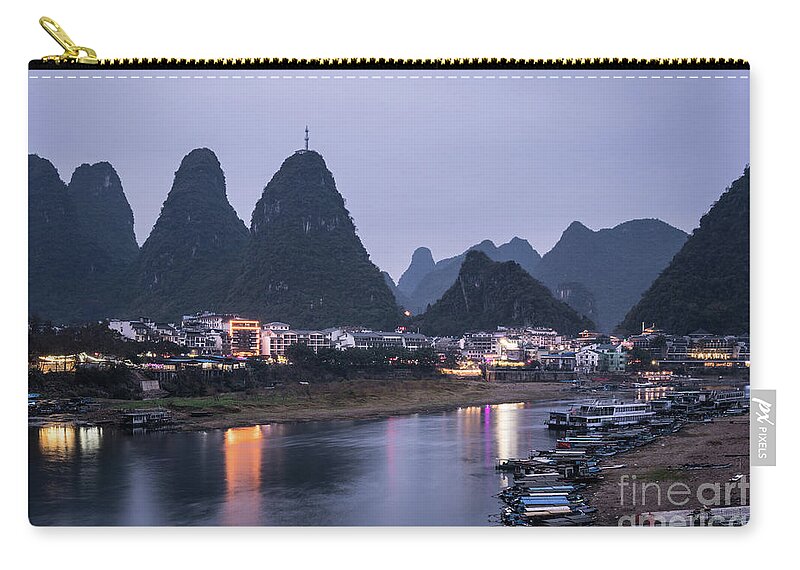 China - East Asia Zip Pouch featuring the photograph Twilight over the Lijang river in Yangshuo #1 by Didier Marti