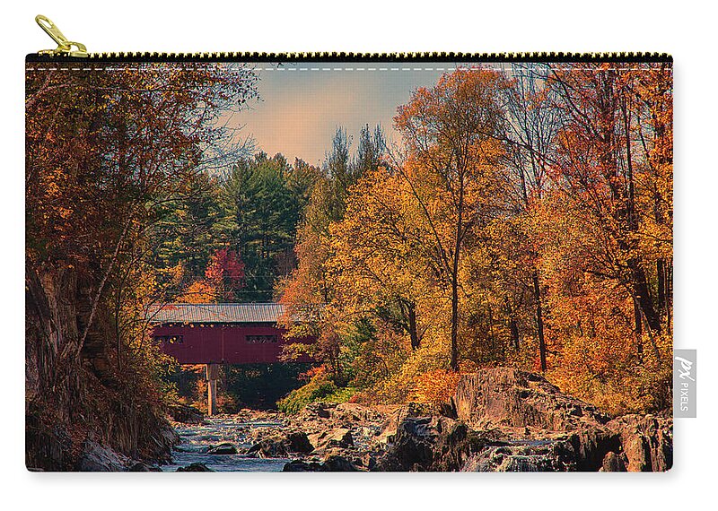 Northfield Falls Covered Bridge Zip Pouch featuring the photograph Vermont covered bridge over the Dog River by Jeff Folger