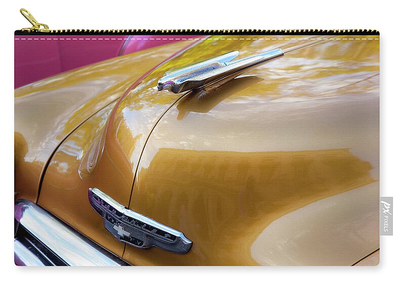 Vintage Zip Pouch featuring the photograph Vintage Chevy Hood Ornament Havana Cuba #1 by Charles Harden