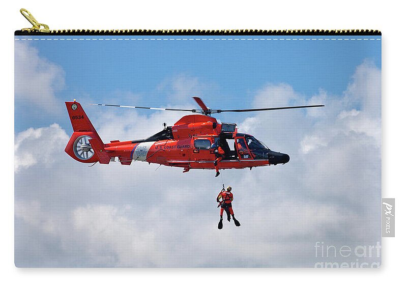 Coast Guard Zip Pouch featuring the photograph US Coast Guard MH-65-C Dauphin Rescue helicopter #2 by Anthony Totah