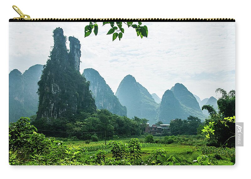 Karst Zip Pouch featuring the photograph Karst mountains and rural scenery #30 by Carl Ning