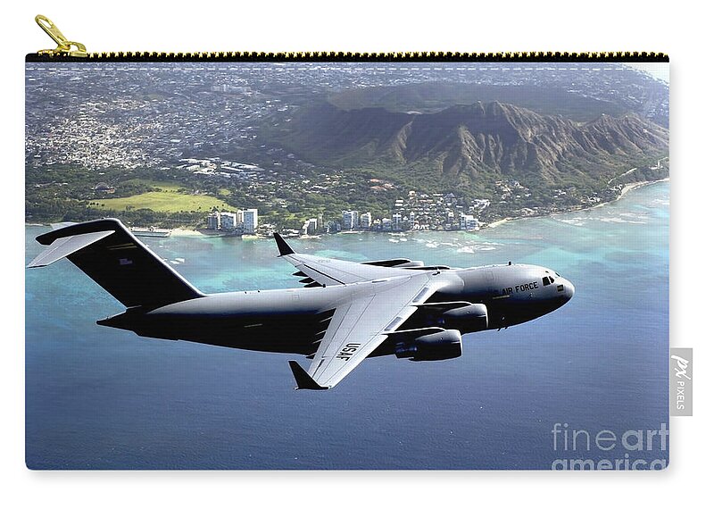Color Image Zip Pouch featuring the photograph A C-17 Globemaster IIi Flies by Stocktrek Images