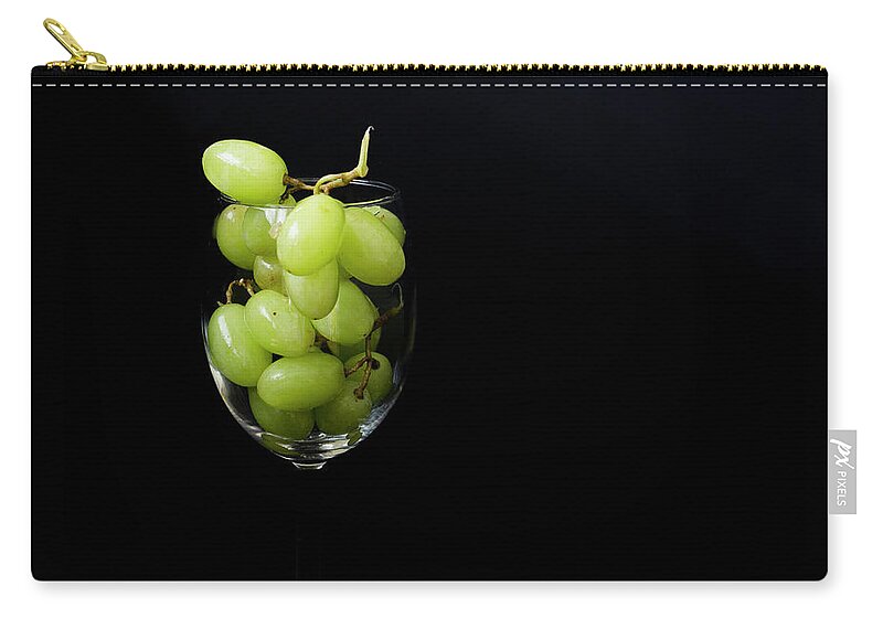 Glass Zip Pouch featuring the photograph A glass of white wine by Agnes Caruso