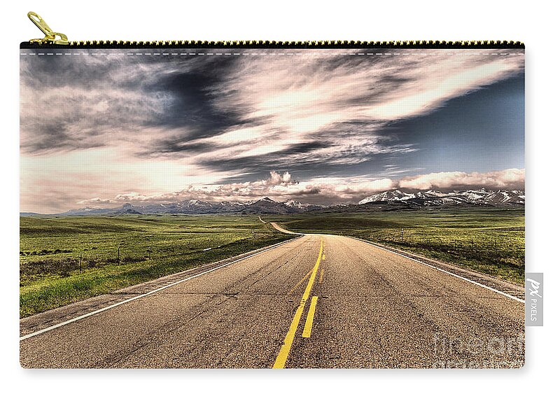 Road Zip Pouch featuring the photograph A long road to the mountains by Jeff Swan