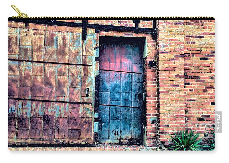 Diana Mary Sharpton Photography Zip Pouch featuring the photograph A Rusty Loading Dock Door by Diana Mary Sharpton