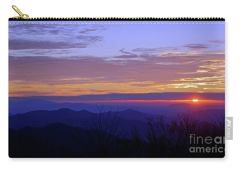 A Sliver Of Sun Zip Pouch featuring the photograph A Sliver of Sun by Jennifer Robin