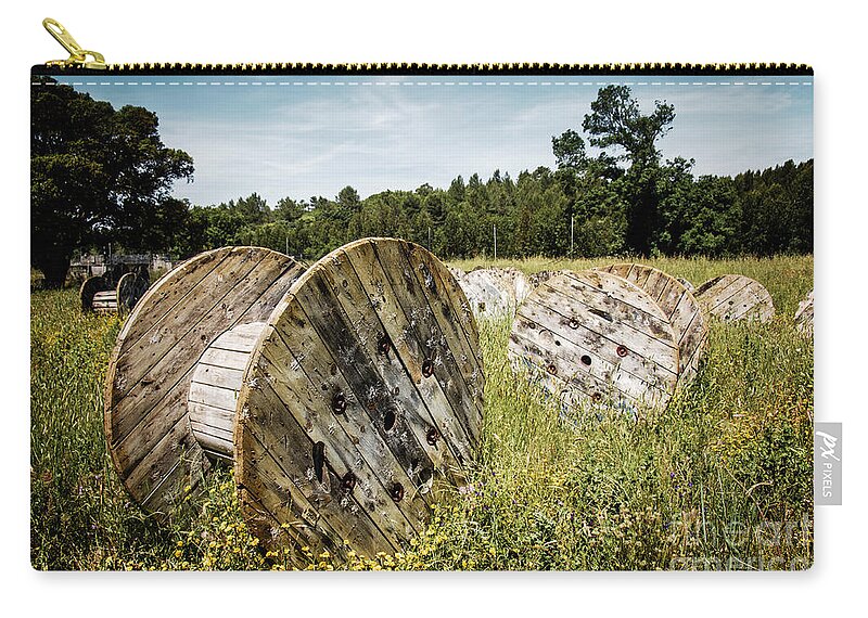 Cable Zip Pouch featuring the photograph Abandoned Cable Reels by Carlos Caetano