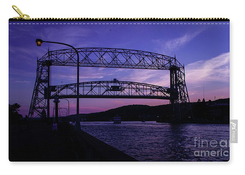 Lake Zip Pouch featuring the photograph Aerial Lift Bridge at Sundown by Deborah Klubertanz