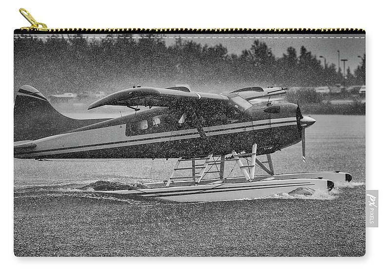 Anchorage Zip Pouch featuring the photograph Alaska Bush Plane in Storm by Scott Slone