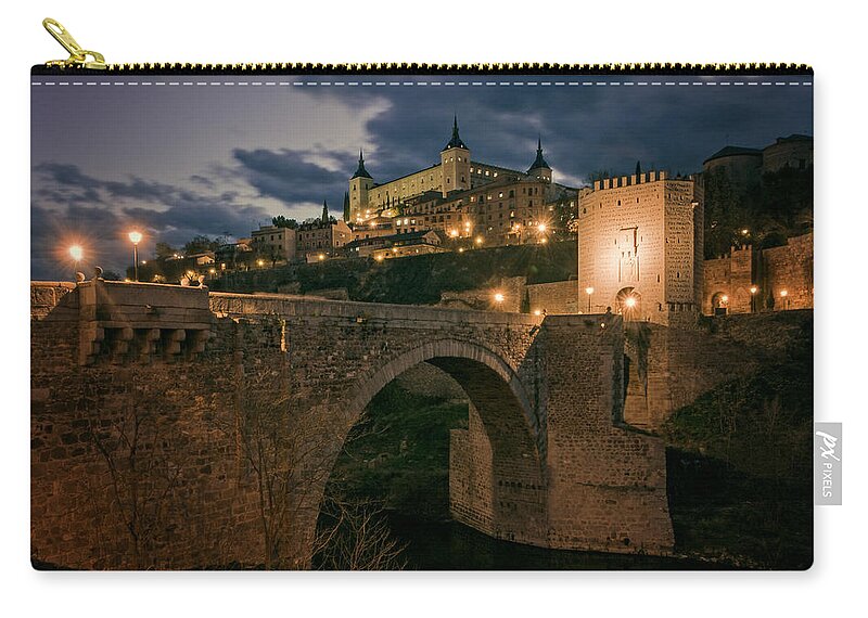 Joan Carroll Zip Pouch featuring the photograph Alcantara Bridge and Alcazar Toledo Night by Joan Carroll