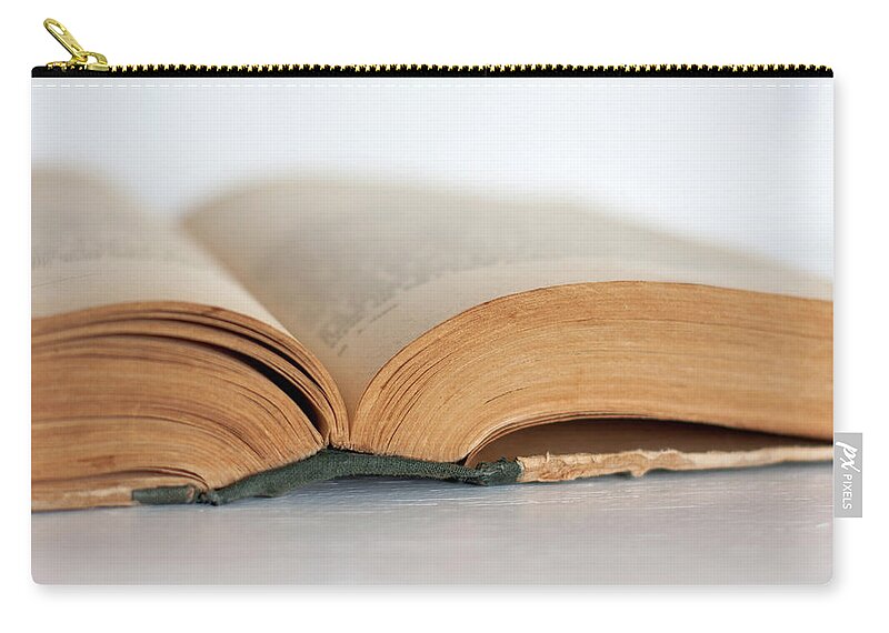 Book Zip Pouch featuring the photograph An Open Book by Andrei Shliakhau