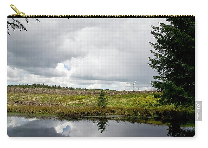Felling Zip Pouch featuring the photograph At the edge of felling. by Elena Perelman