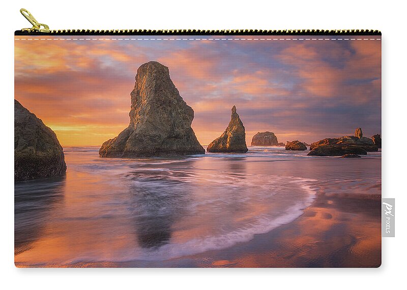 Sunset Zip Pouch featuring the photograph Bandon's New Years Eve Light Show by Darren White