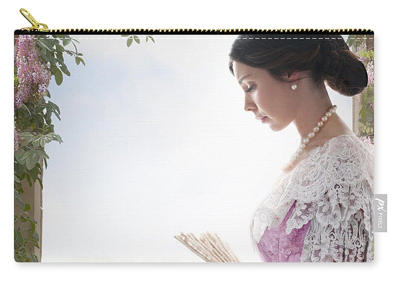 Victorian Zip Pouch featuring the photograph Beautiful Victorian Woman In Pink Dress Standing Under A Wisteri by Lee Avison